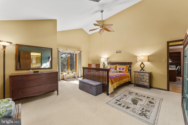 bedroom with light carpet, high vaulted ceiling, and ceiling fan