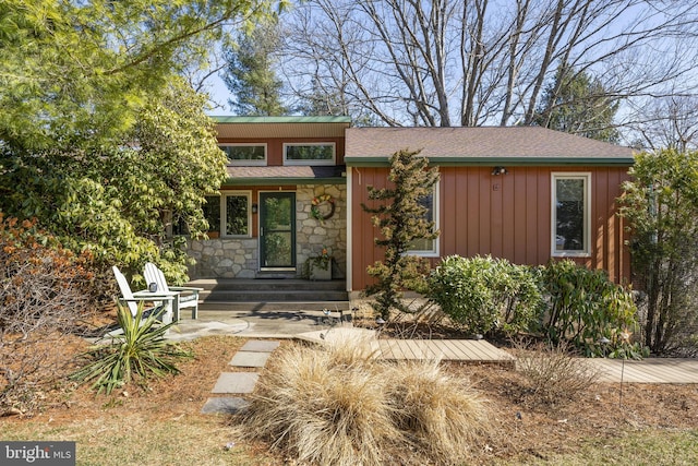 view of front of home with stone siding