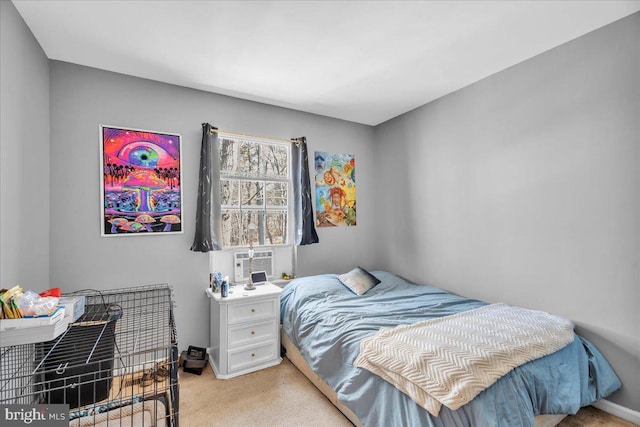 bedroom with light colored carpet and cooling unit