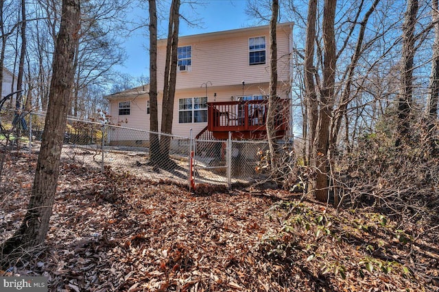 back of property with fence