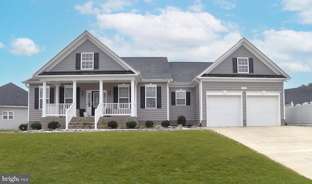 view of front of property featuring a front yard, fence, a porch, concrete driveway, and a garage