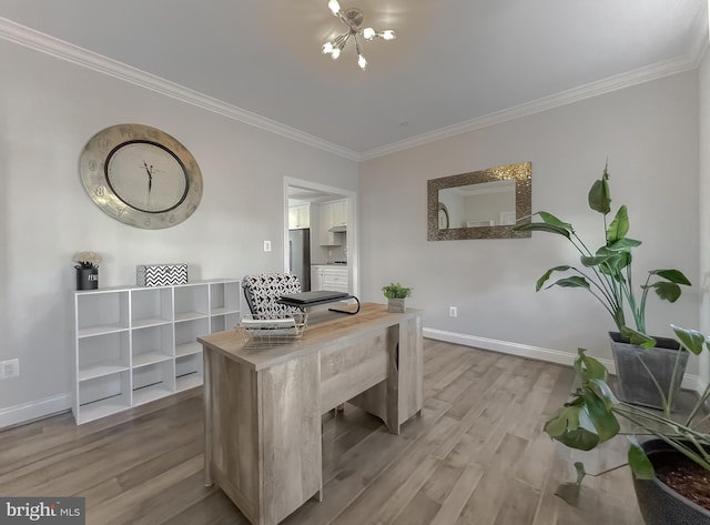 office space featuring an inviting chandelier, crown molding, baseboards, and wood finished floors