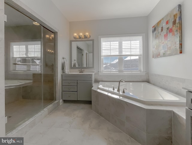 full bath with vanity, a garden tub, marble finish floor, and a shower stall