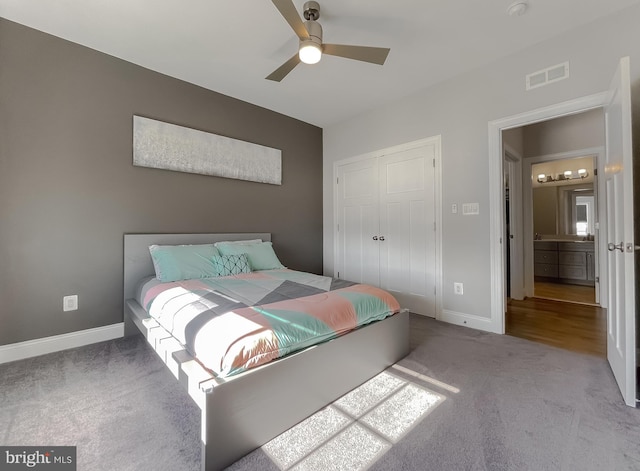 bedroom with a ceiling fan, carpet, visible vents, baseboards, and a closet