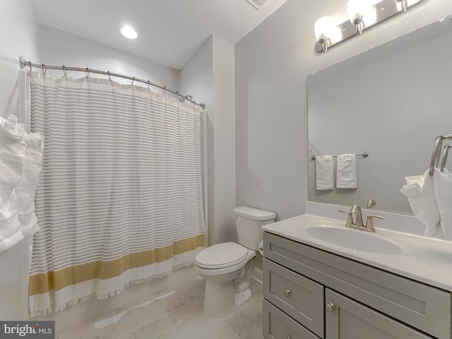 bathroom with toilet, marble finish floor, shower / tub combo with curtain, and vanity