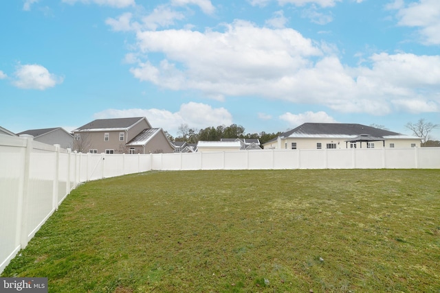 view of yard with a fenced backyard