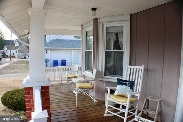 wooden deck featuring covered porch