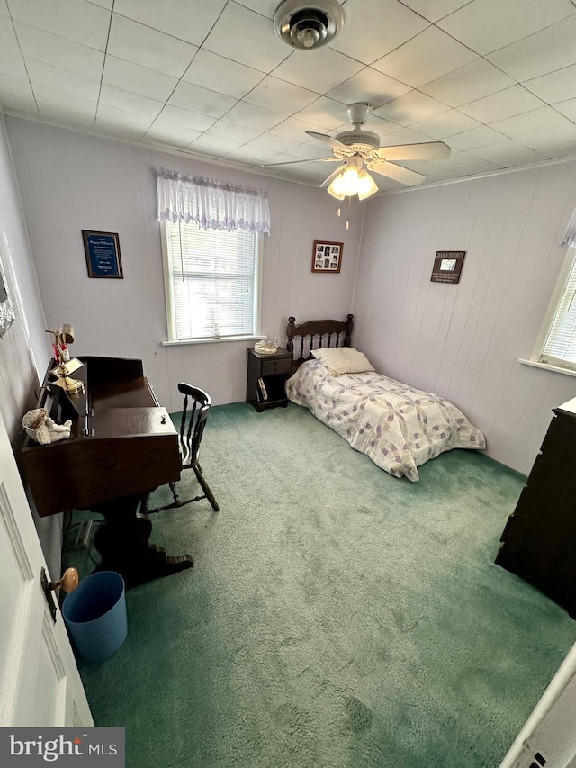 bedroom with visible vents, ceiling fan, and carpet floors