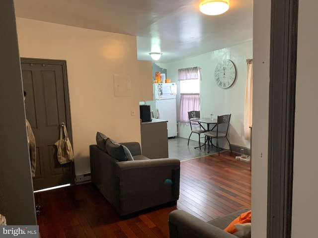 living room with baseboards and hardwood / wood-style floors