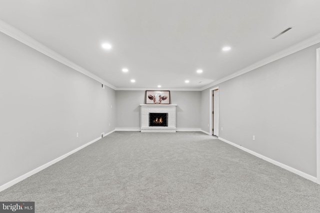 unfurnished living room featuring visible vents, ornamental molding, recessed lighting, a fireplace, and baseboards