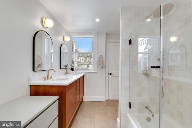 full bath featuring a sink, shower / bathing tub combination, double vanity, and tile patterned flooring