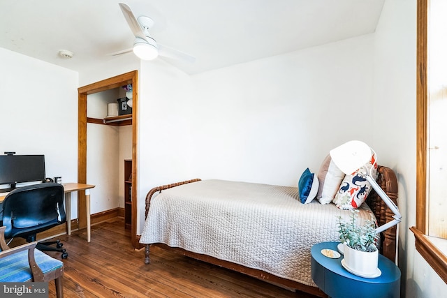 bedroom with a ceiling fan and wood finished floors