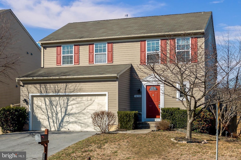 view of front of home with a garage and driveway