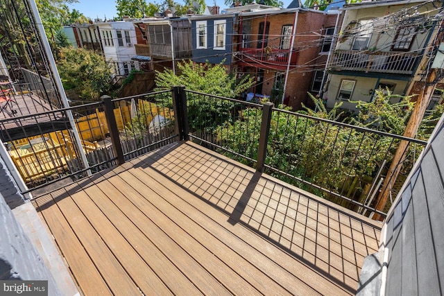 wooden terrace featuring a residential view