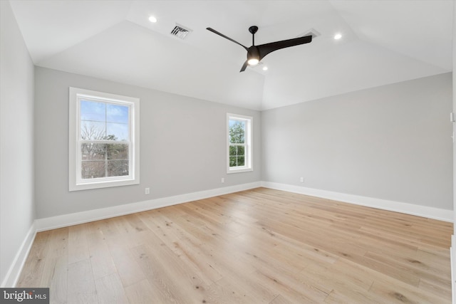 empty room featuring lofted ceiling, a ceiling fan, recessed lighting, light wood finished floors, and baseboards