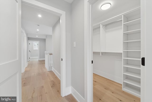 spacious closet with light wood finished floors