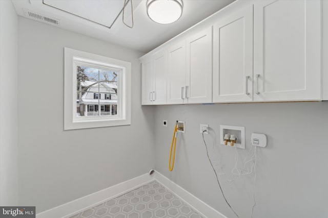 laundry area featuring visible vents, hookup for a gas dryer, cabinet space, baseboards, and hookup for a washing machine