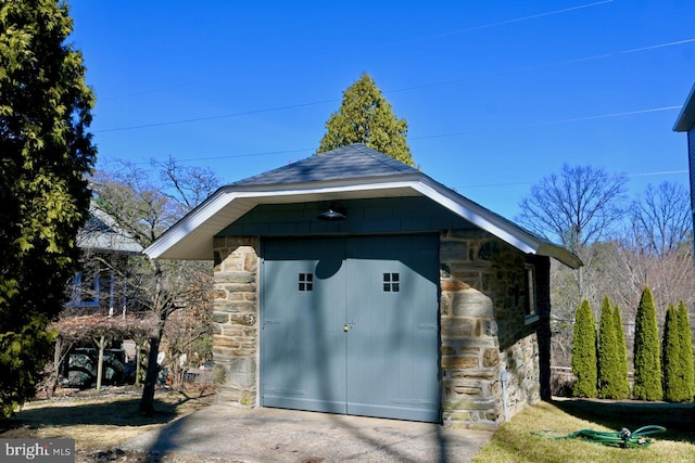 view of outbuilding with an outdoor structure and fence