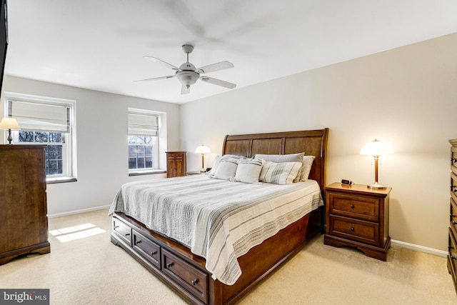 bedroom with baseboards, light carpet, and ceiling fan