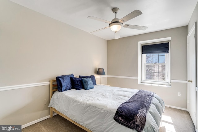 carpeted bedroom with baseboards and ceiling fan