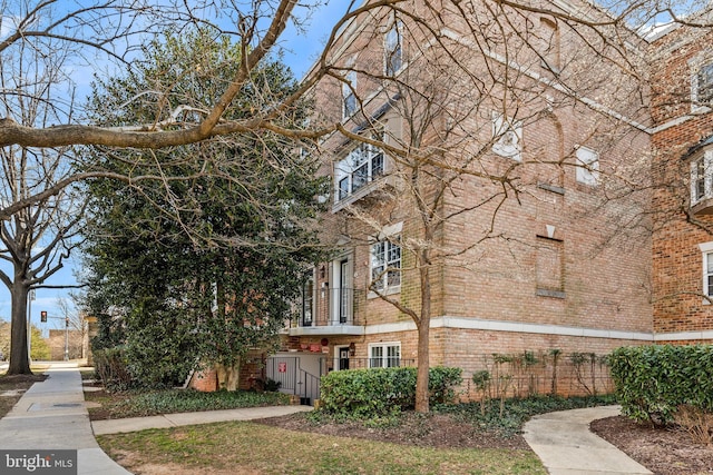 exterior space with brick siding