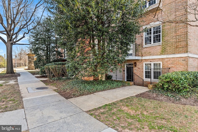 exterior space with brick siding