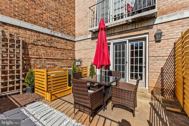 wooden terrace with outdoor dining area