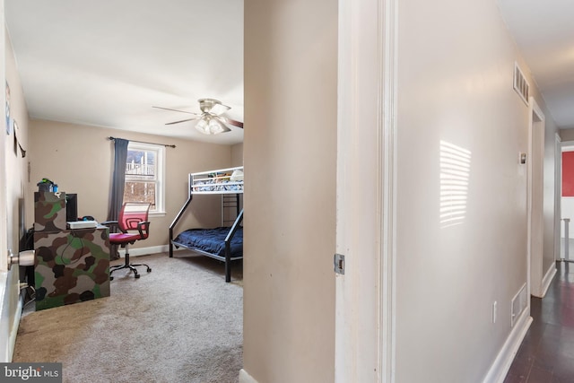 bedroom with a ceiling fan, carpet flooring, baseboards, and visible vents