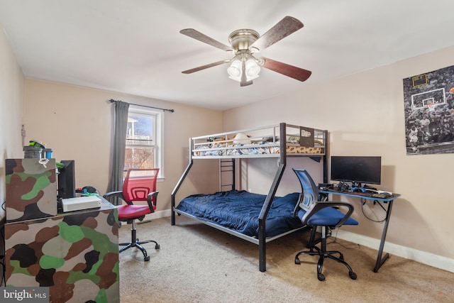 carpeted bedroom featuring a ceiling fan and baseboards