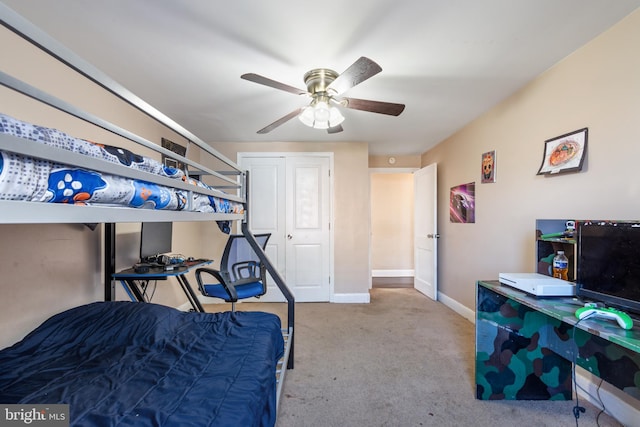 bedroom with baseboards, a ceiling fan, and carpet flooring