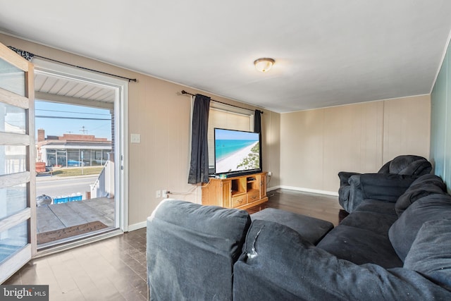 living area featuring wood finished floors and baseboards