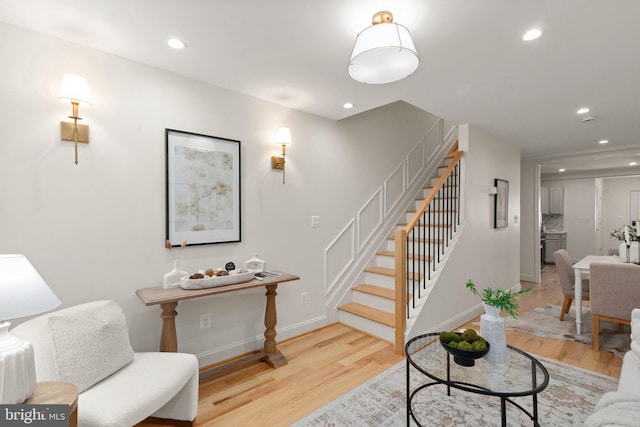 interior space featuring recessed lighting, baseboards, and wood finished floors