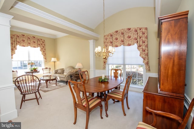 dining space featuring a chandelier, plenty of natural light, carpet floors, and wainscoting