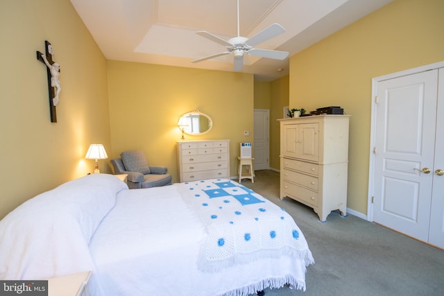 carpeted bedroom with a ceiling fan and baseboards