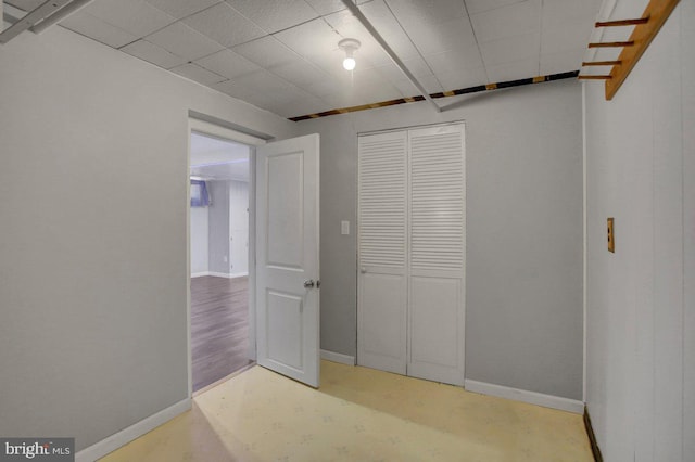 interior space featuring baseboards and a closet