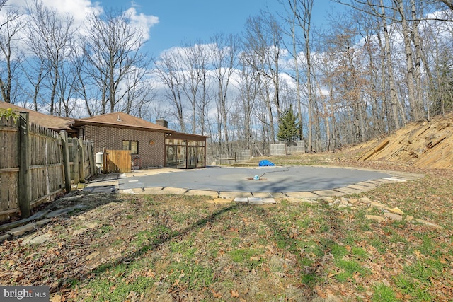 view of yard featuring a patio and fence