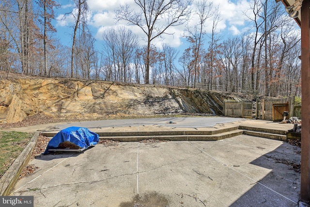 view of patio / terrace featuring fence