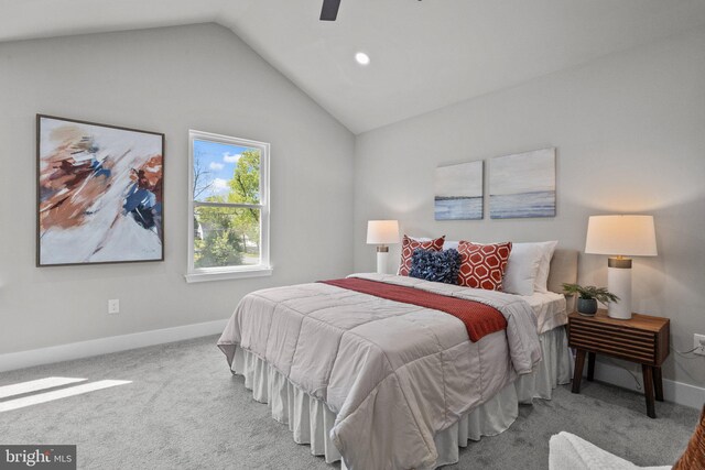 bedroom featuring carpet flooring, a ceiling fan, baseboards, and vaulted ceiling