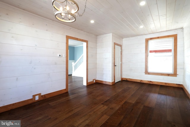 unfurnished room with recessed lighting, a chandelier, dark wood-type flooring, and wooden ceiling