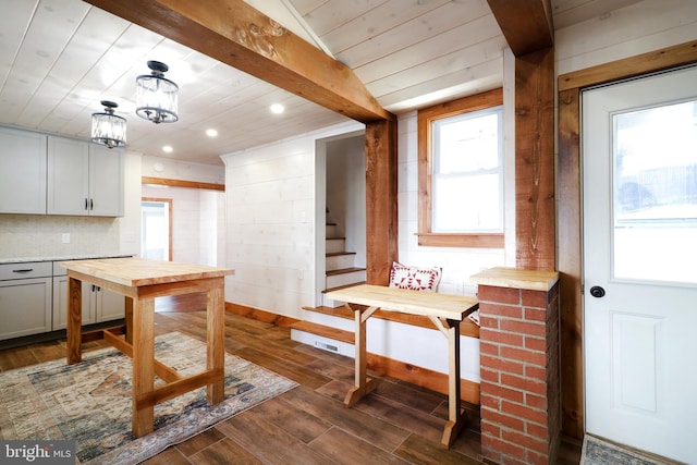 kitchen with dark wood-style flooring, decorative backsplash, wood counters, wooden ceiling, and beamed ceiling