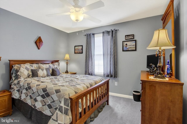 bedroom featuring baseboards, carpet floors, and ceiling fan