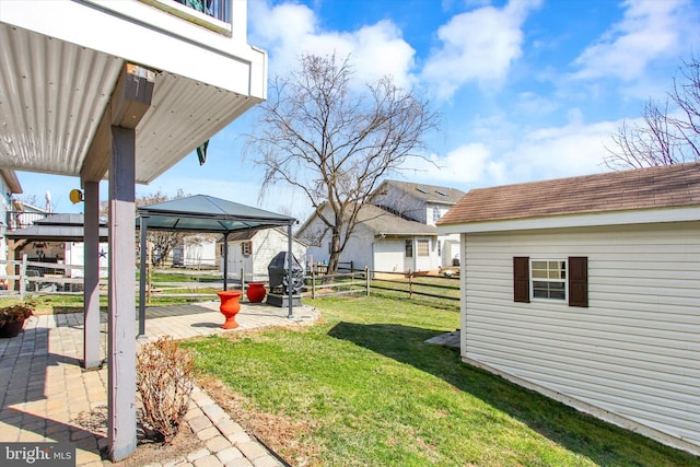 view of yard featuring a gazebo, fence, and a patio area