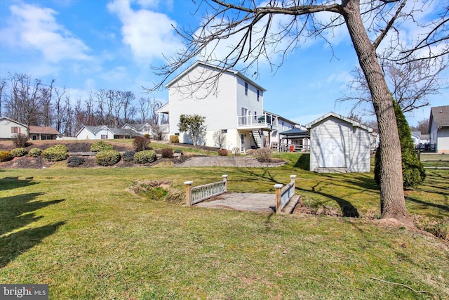 view of side of home with a storage shed, an outbuilding, and a yard