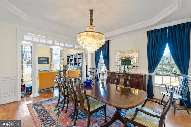 dining room featuring ornate columns and ornamental molding