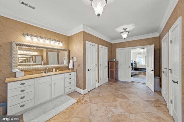 bathroom with visible vents, wallpapered walls, vanity, and ornamental molding