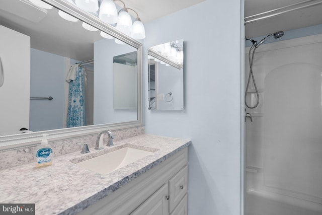 full bath with curtained shower and vanity