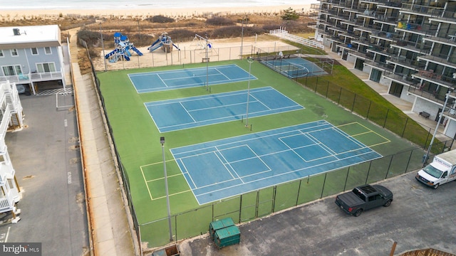 birds eye view of property featuring a view of the beach and a water view