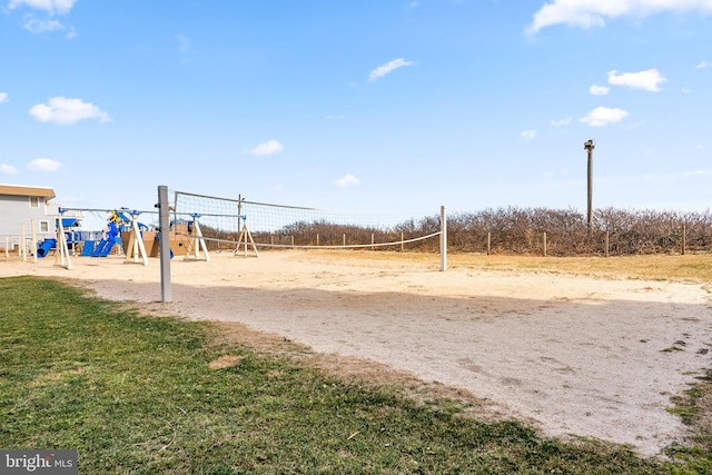 view of community featuring playground community and volleyball court