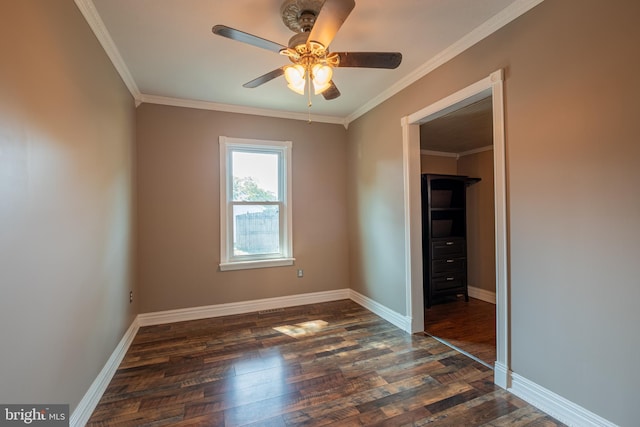 unfurnished bedroom with baseboards, dark wood-type flooring, ceiling fan, and crown molding