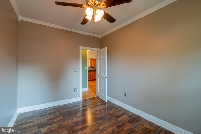 unfurnished room featuring baseboards, a ceiling fan, dark wood-style floors, and crown molding